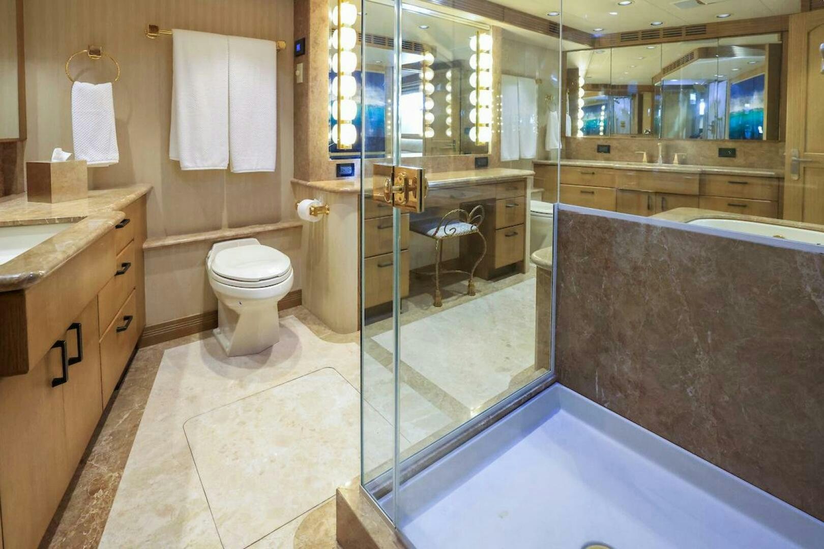 a bathroom with a glass shower aboard NORTH COAST Yacht for Sale