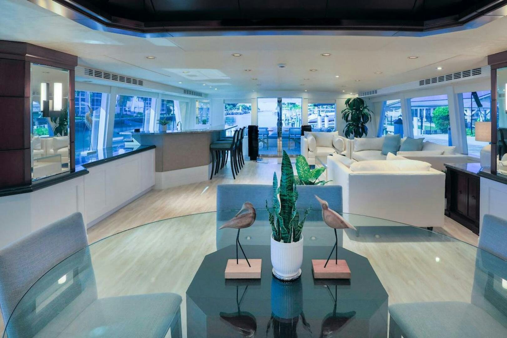 a room with a table and chairs aboard NORTH COAST Yacht for Sale