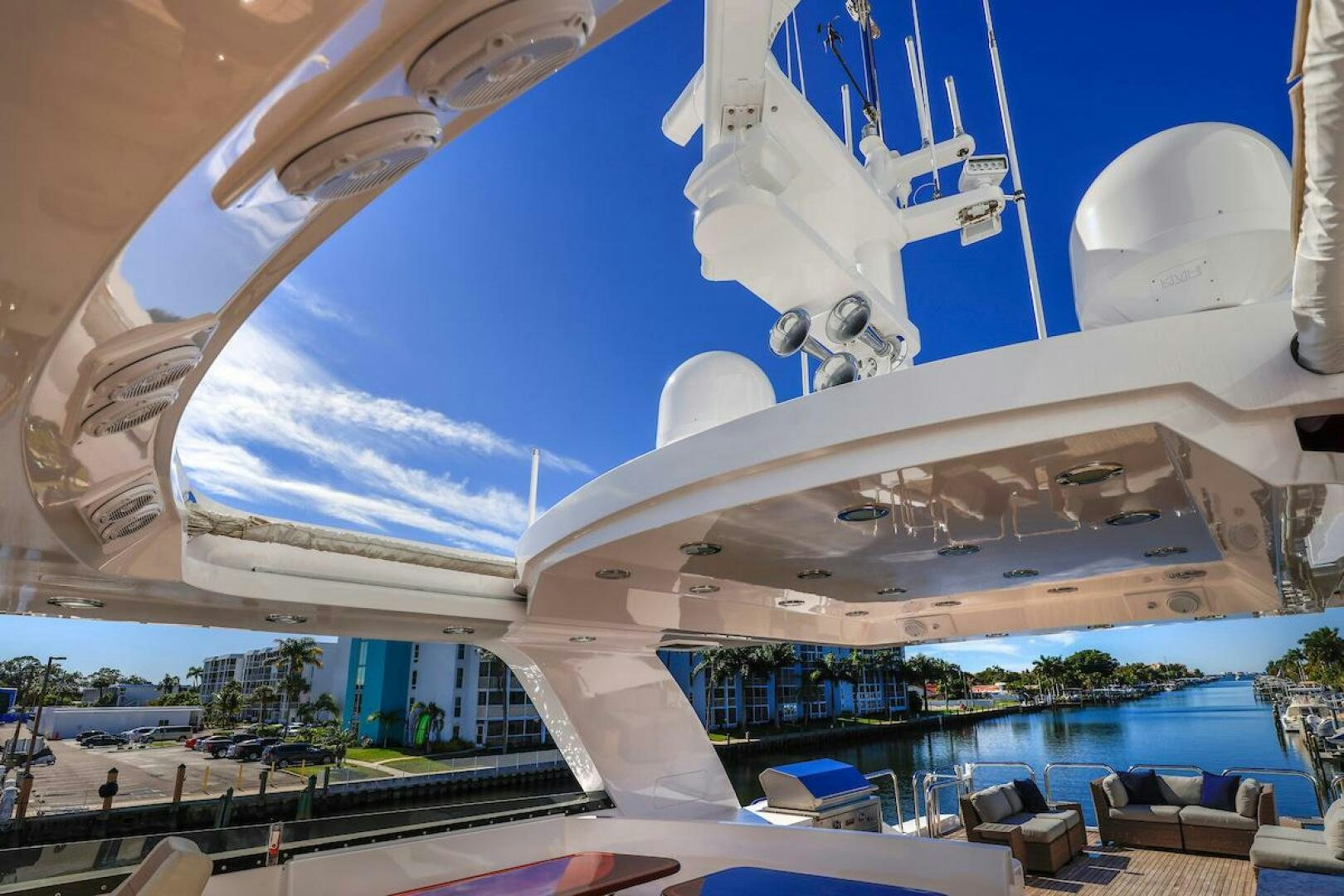 a large white building with a curved roof and a pool aboard NORTH COAST Yacht for Sale