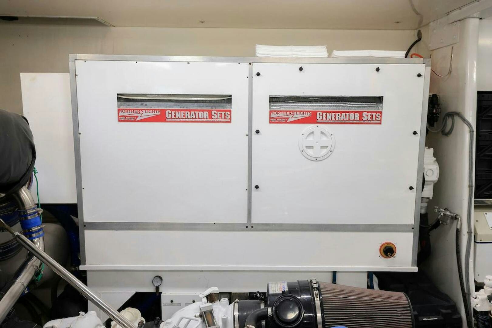 a white machine with a red label aboard NORTH COAST Yacht for Sale