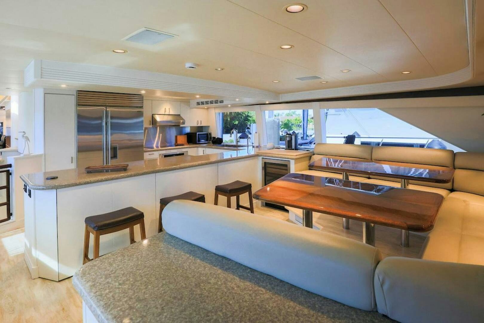 a living room with a couch and a table aboard NORTH COAST Yacht for Sale
