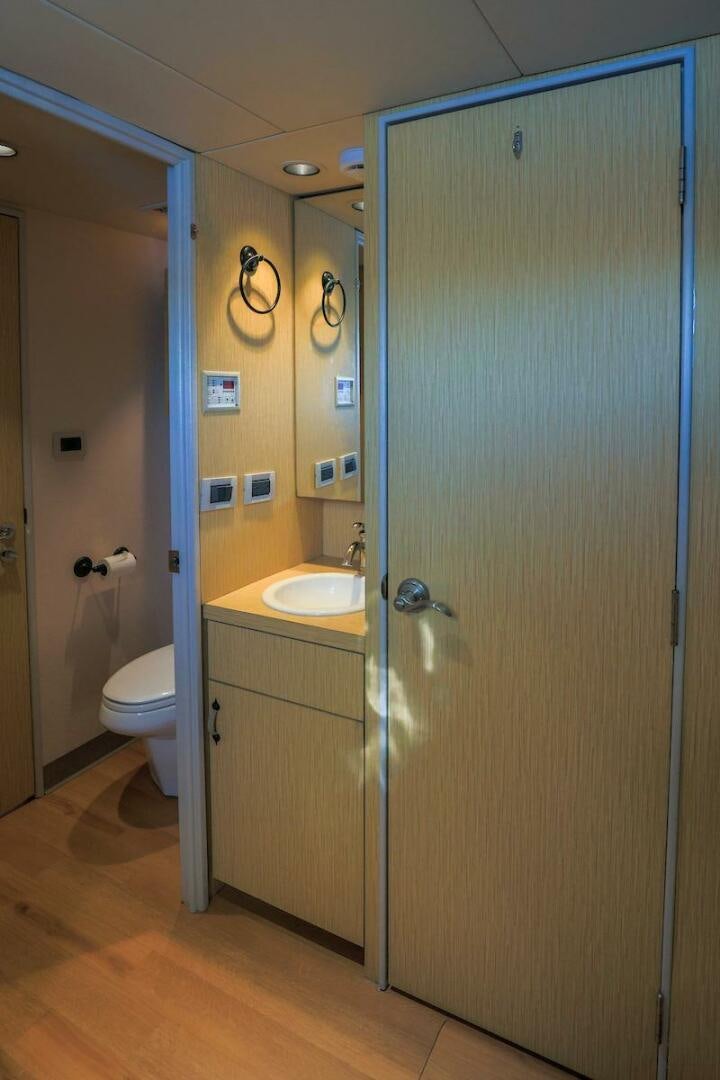 a bathroom with a sink and a toilet aboard NORTH COAST Yacht for Sale