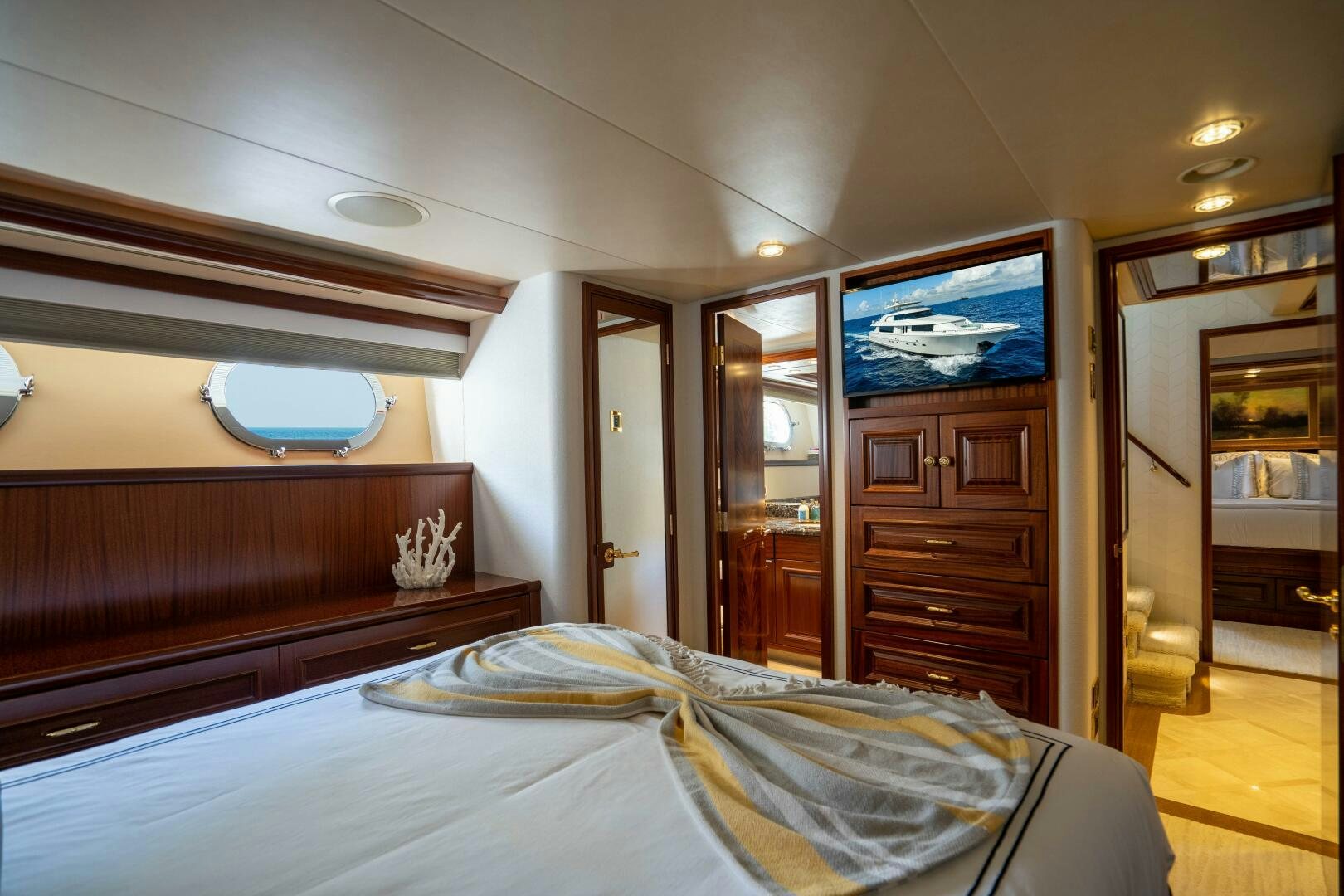 a bedroom with a large tv aboard FIRST LIGHT Yacht for Sale