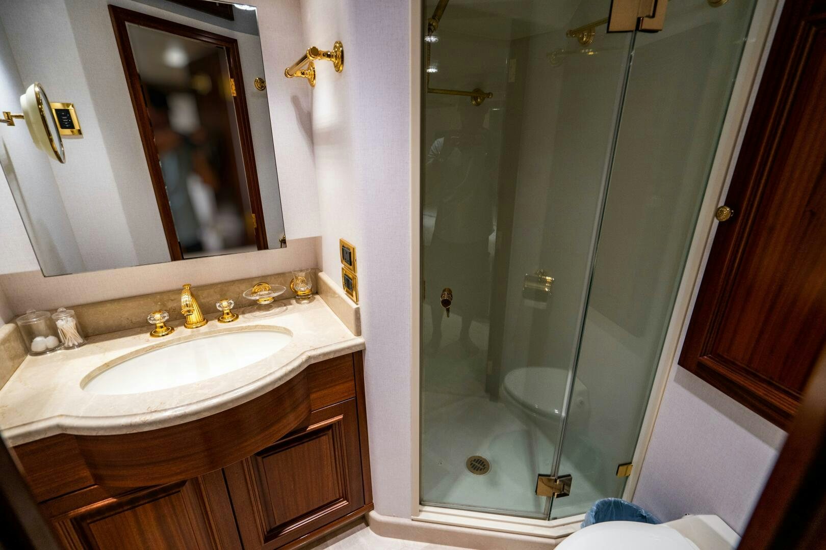 a bathroom with a glass shower aboard FIRST LIGHT Yacht for Sale
