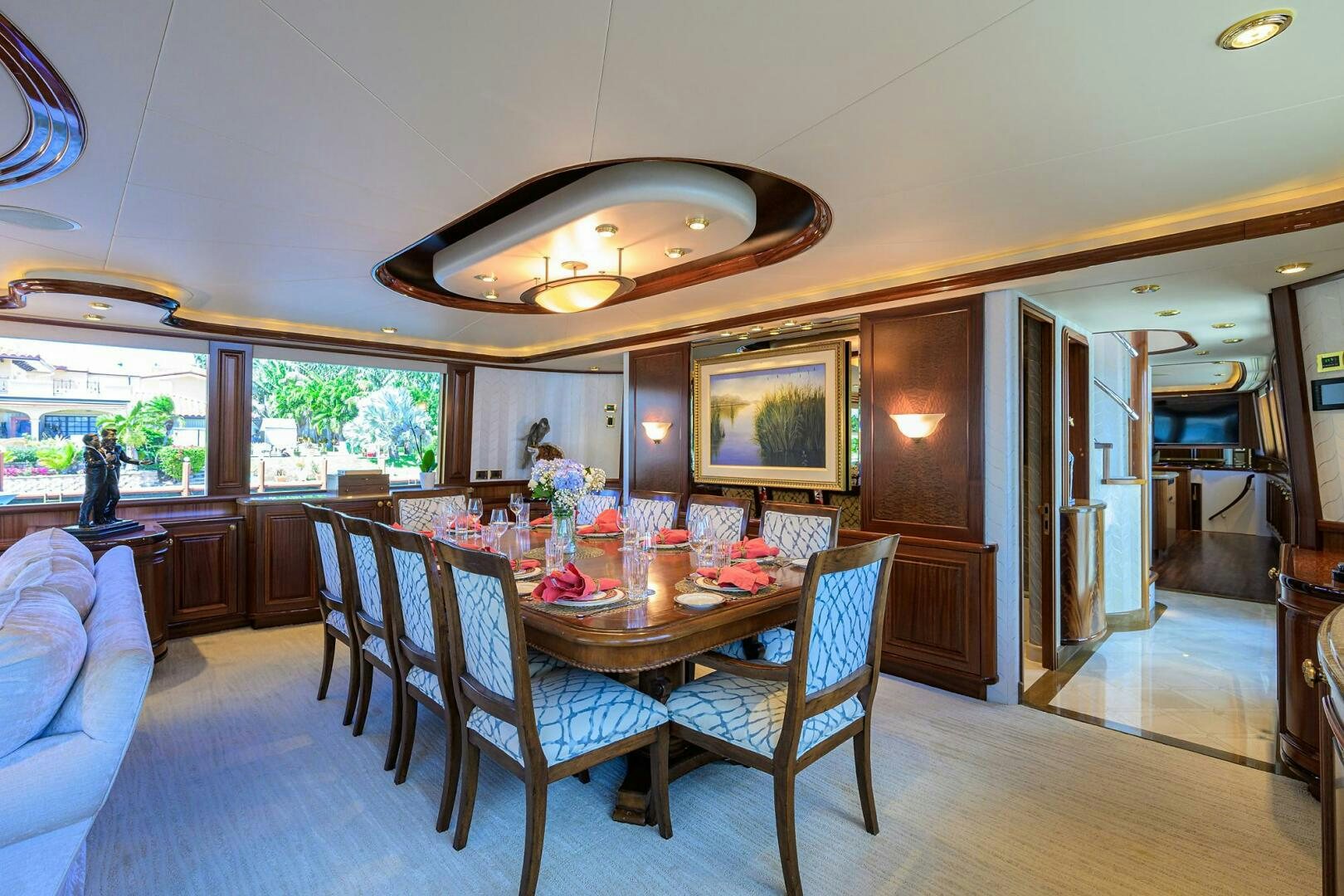 a dining table in a living room aboard FIRST LIGHT Yacht for Sale