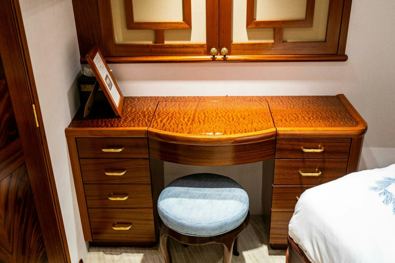 a bathroom with a desk and a chair aboard FIRST LIGHT Yacht for Sale
