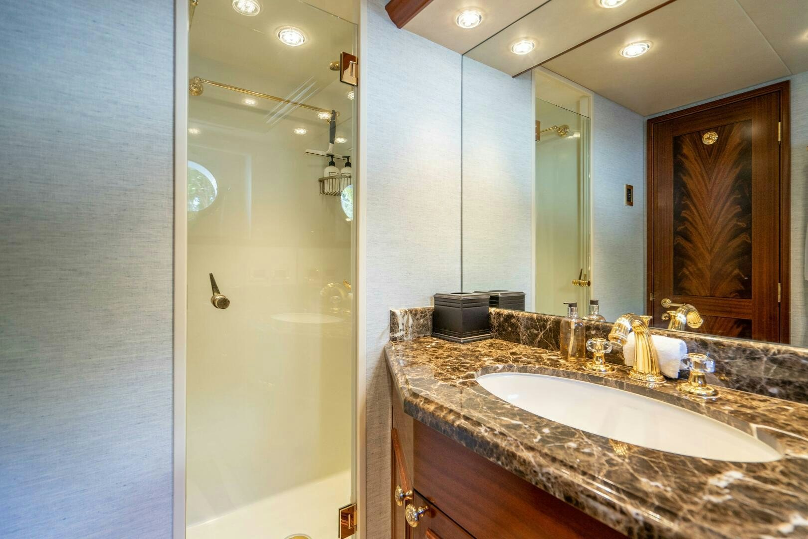 a bathroom with a sink and a mirror aboard FIRST LIGHT Yacht for Sale