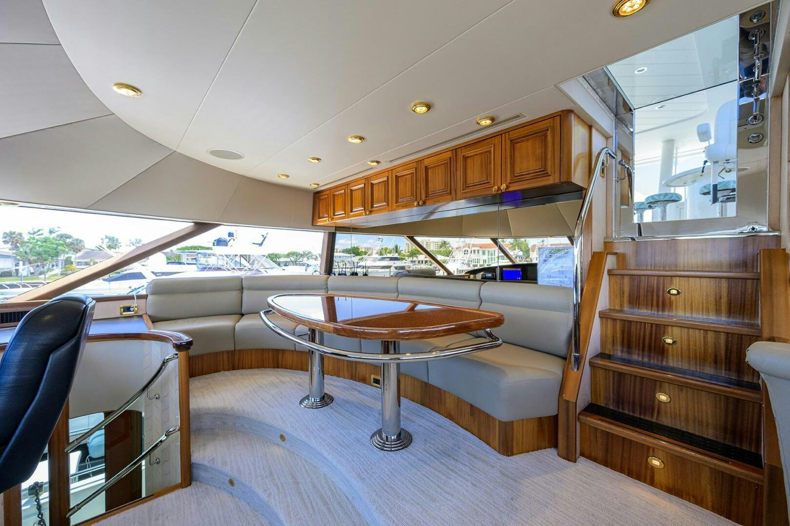 a room with a table and chairs aboard FIRST LIGHT Yacht for Sale
