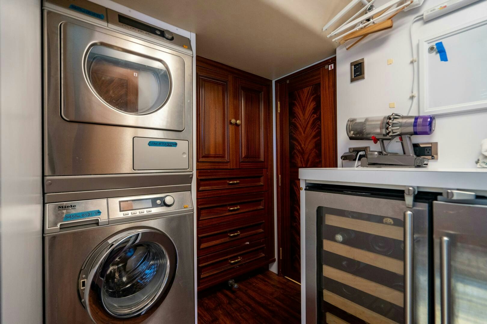 a kitchen with a washing machine and oven aboard FIRST LIGHT Yacht for Sale
