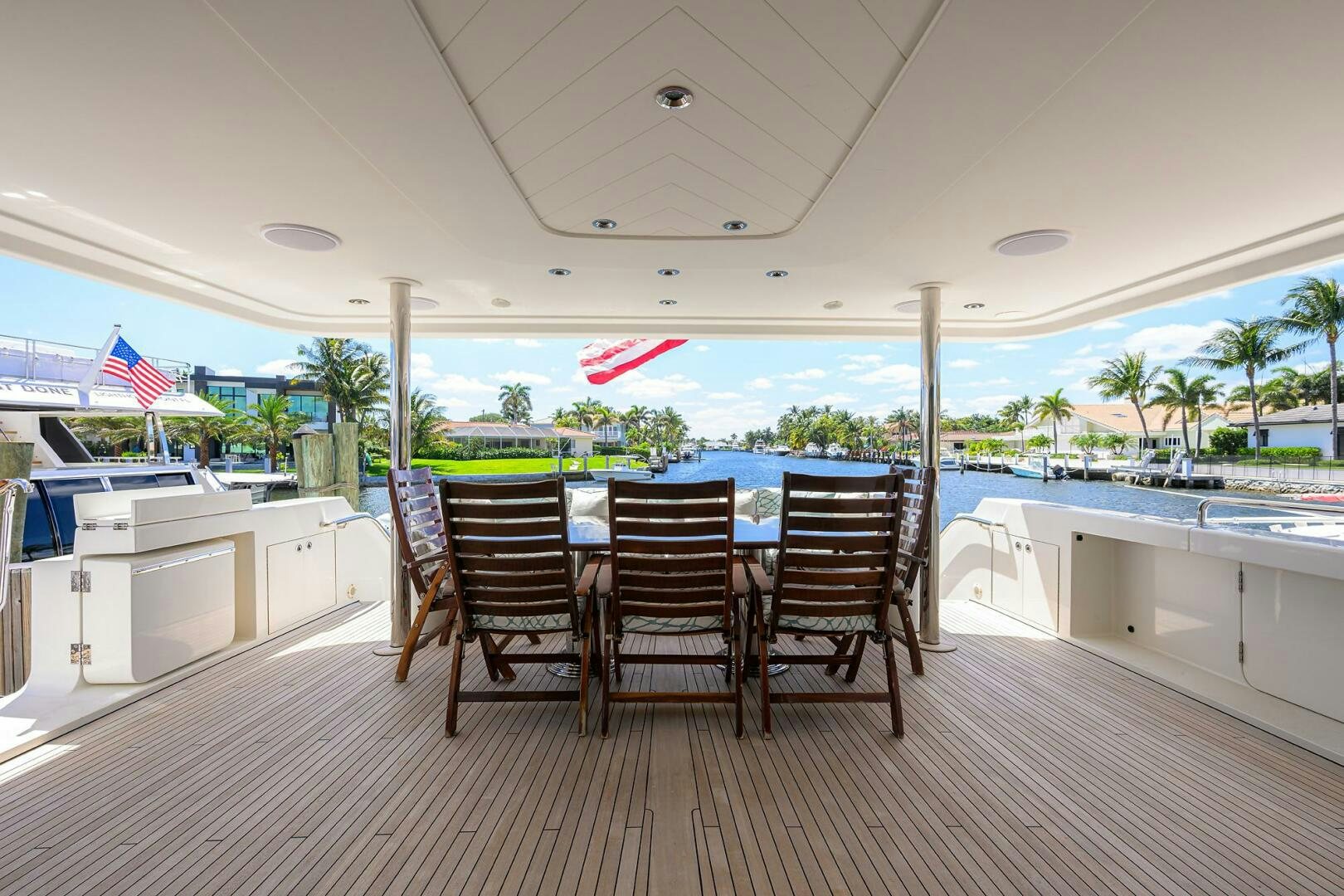 a table and chairs on a deck aboard FIRST LIGHT Yacht for Sale