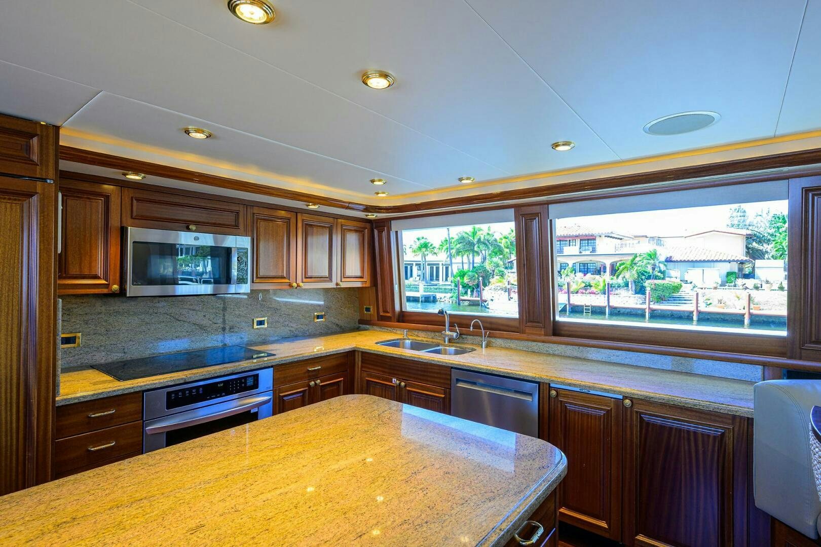 a kitchen with a large window aboard FIRST LIGHT Yacht for Sale