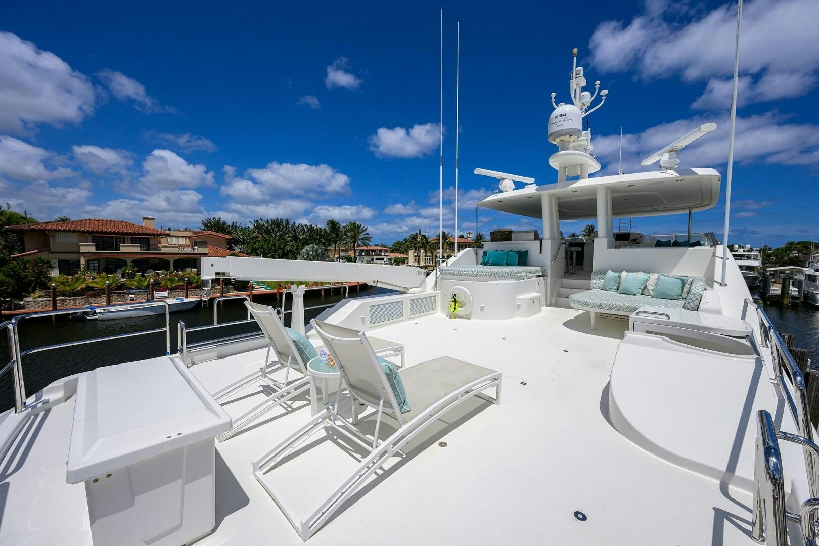 a white boat on a dock aboard FIRST LIGHT Yacht for Sale