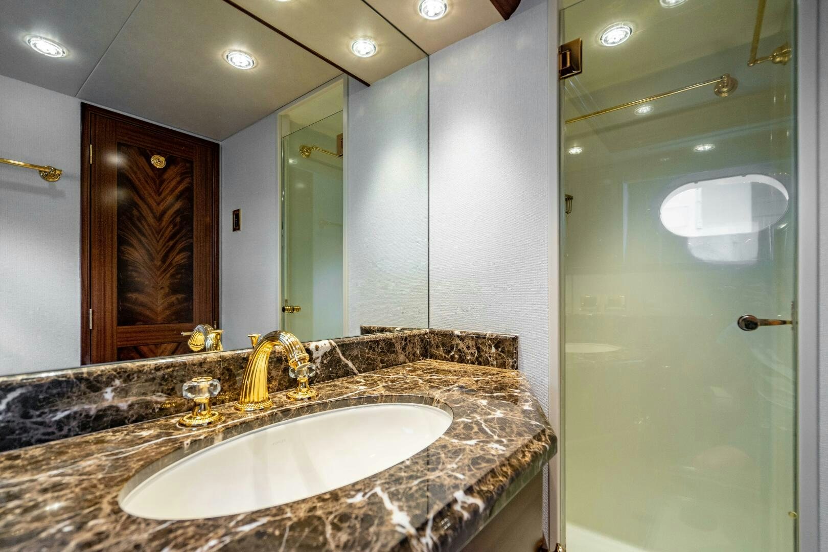 a bathroom with a marble countertop aboard FIRST LIGHT Yacht for Sale