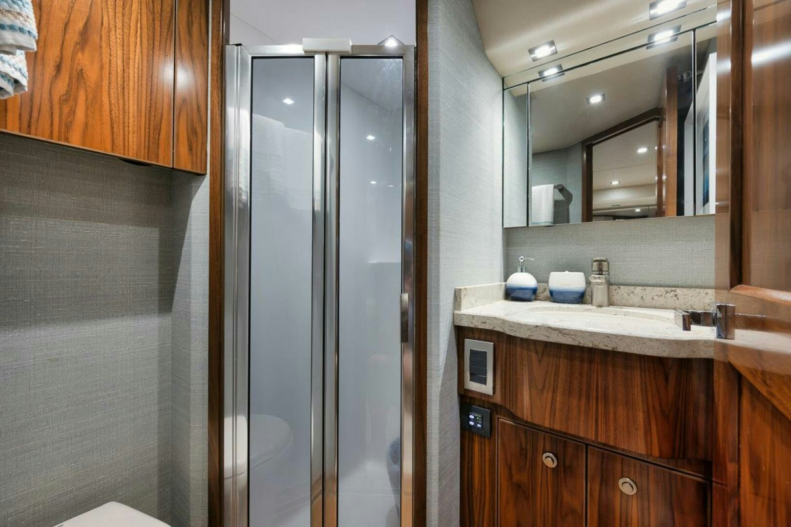 a bathroom with a shower unit and sink aboard JO-LI Yacht for Sale