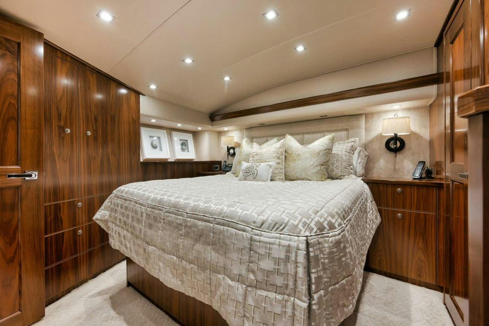 a bedroom with a bed and a wood wall aboard JO-LI Yacht for Sale