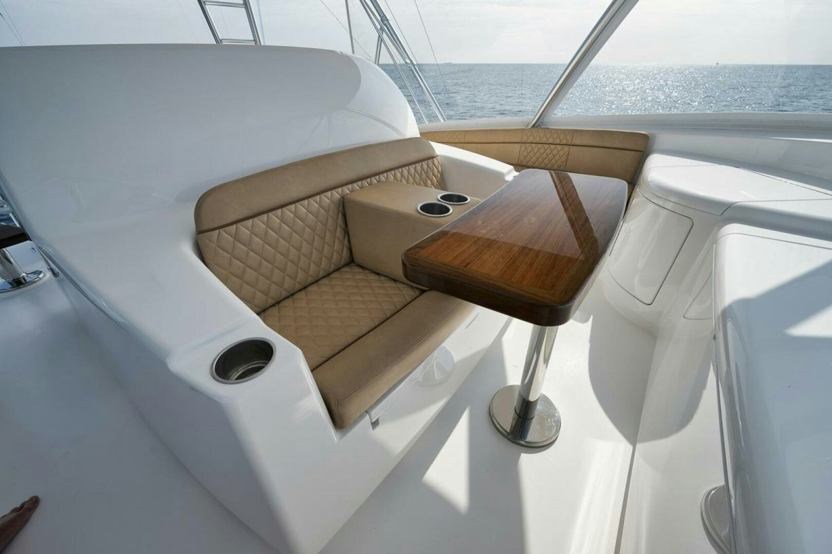 a wooden seat on a white car aboard JO-LI Yacht for Sale