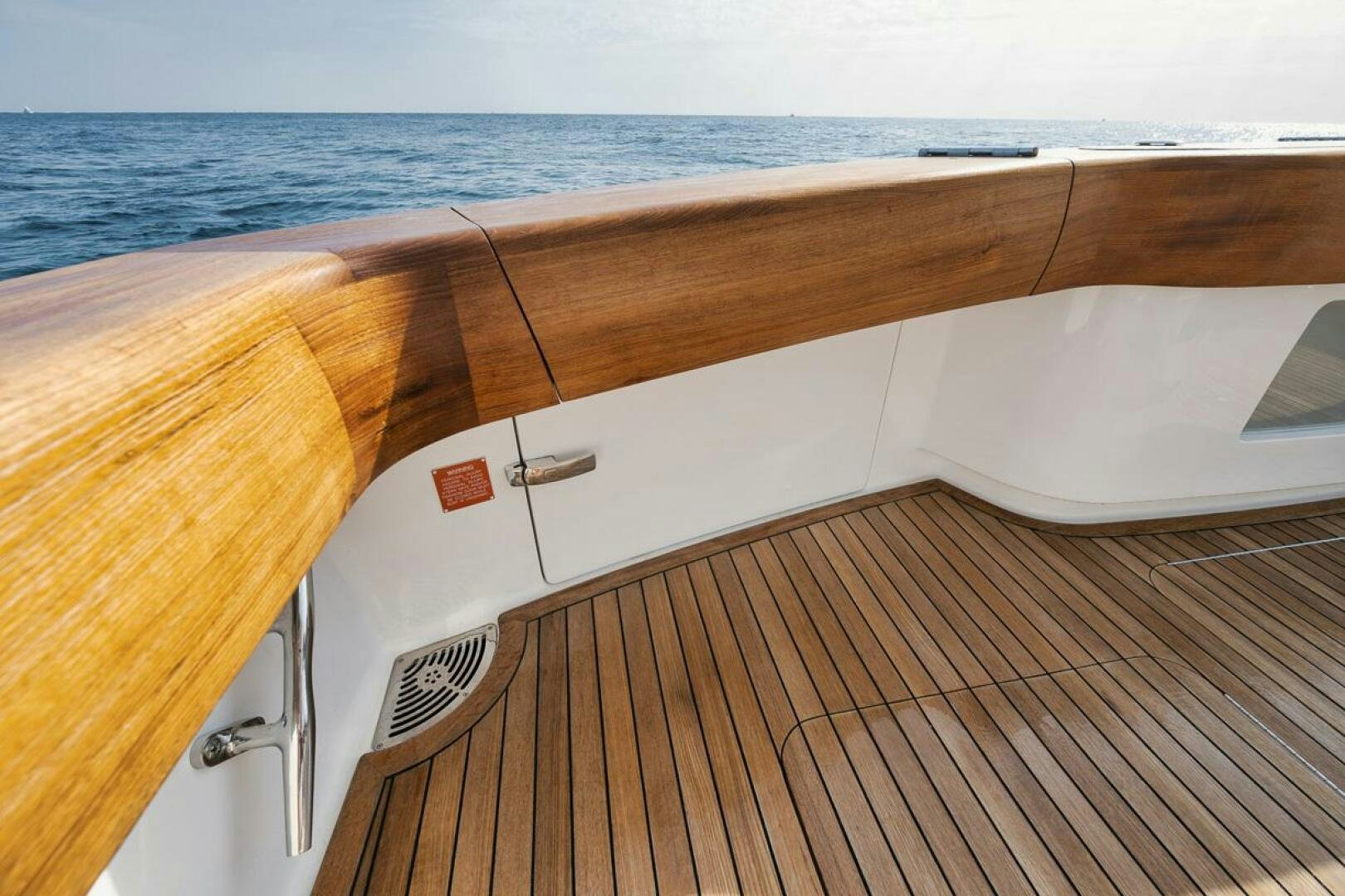 a wooden deck overlooking the ocean aboard JO-LI Yacht for Sale