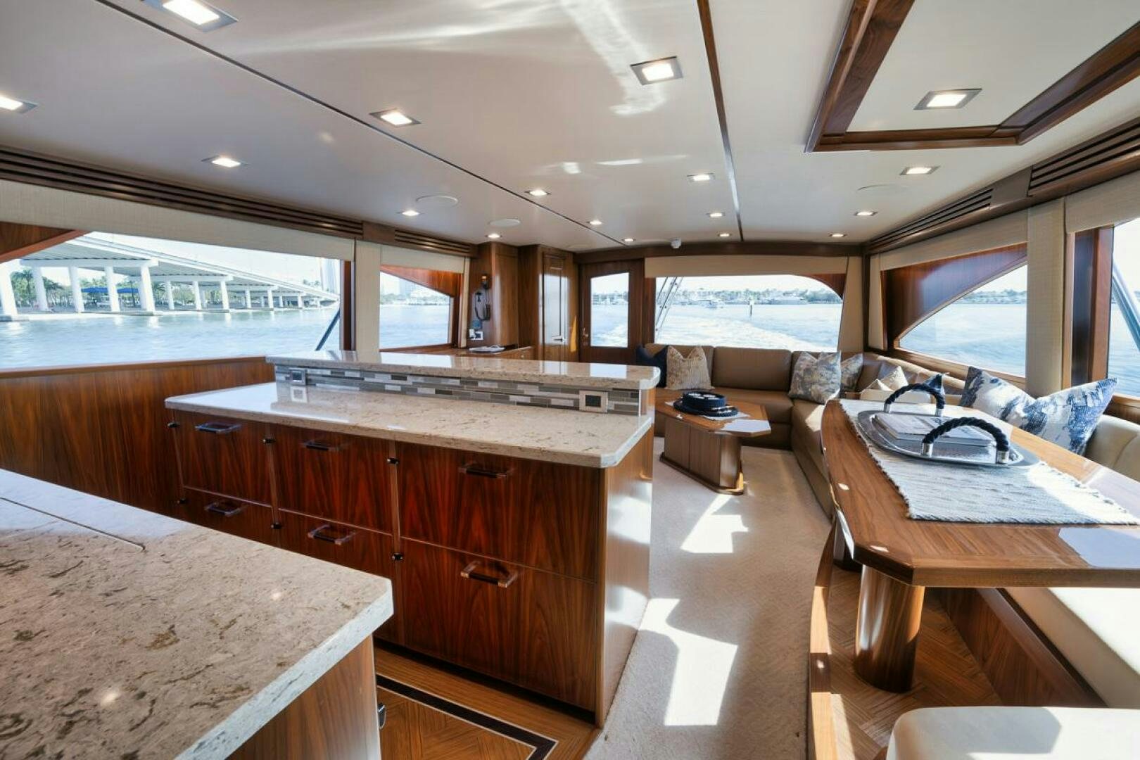 a kitchen with a bar and a table aboard JO-LI Yacht for Sale