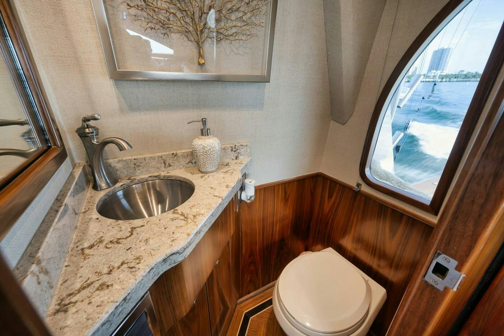 a bathroom with a sink and toilet aboard JO-LI Yacht for Sale