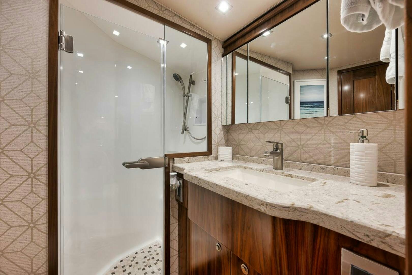 a bathroom with a large mirror aboard JO-LI Yacht for Sale