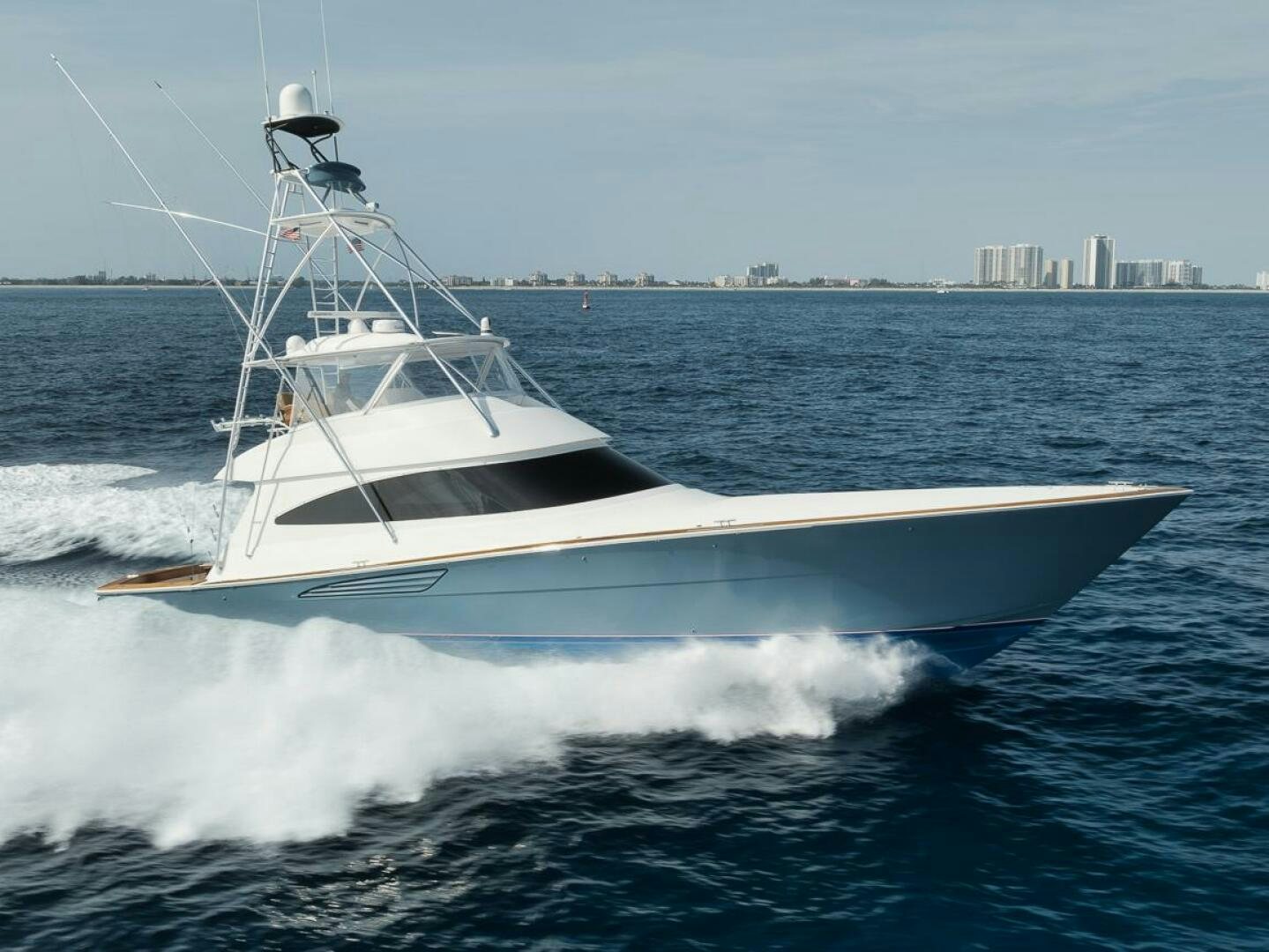 a white boat on the water aboard JO-LI Yacht for Sale