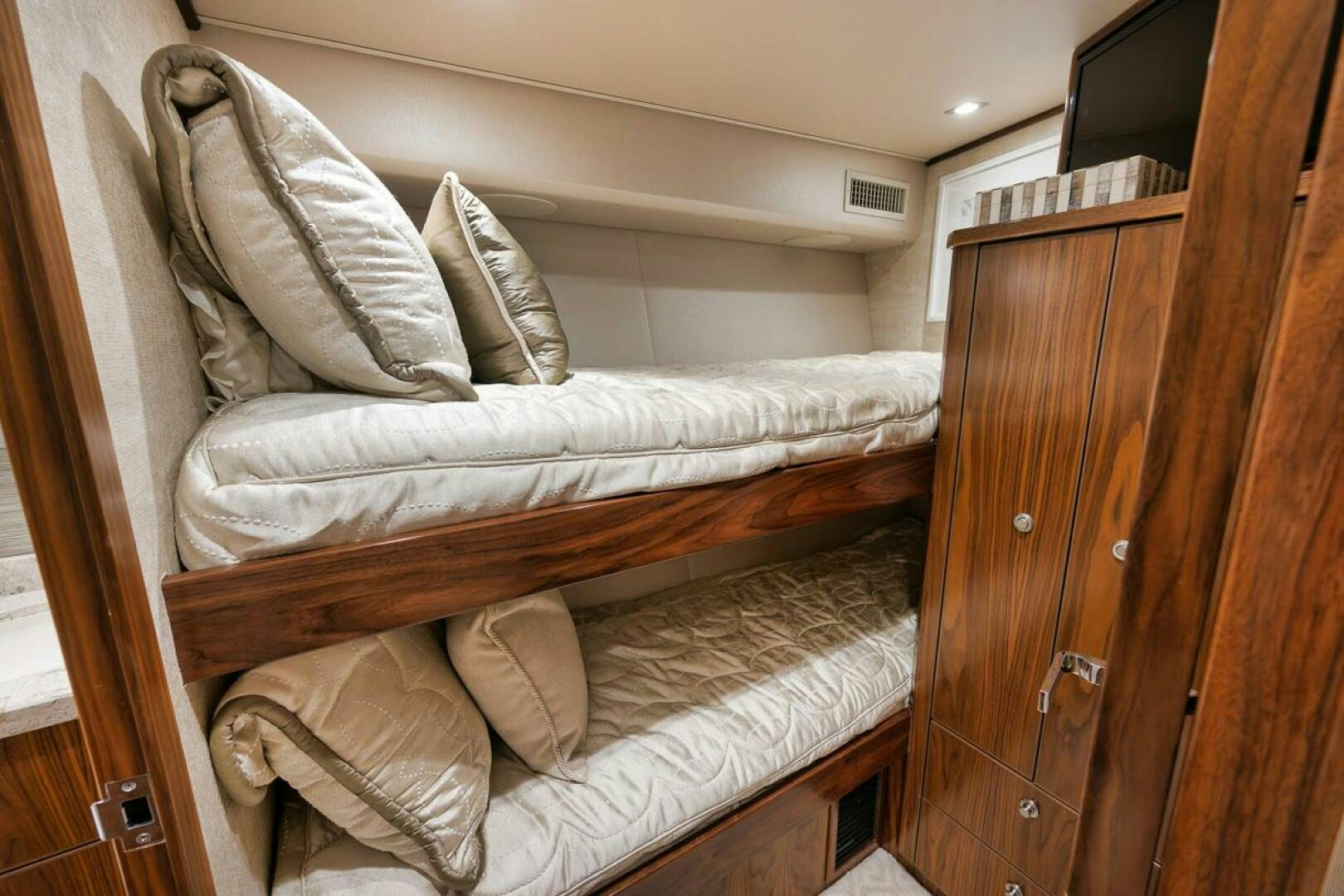 a bed with white sheets aboard JO-LI Yacht for Sale