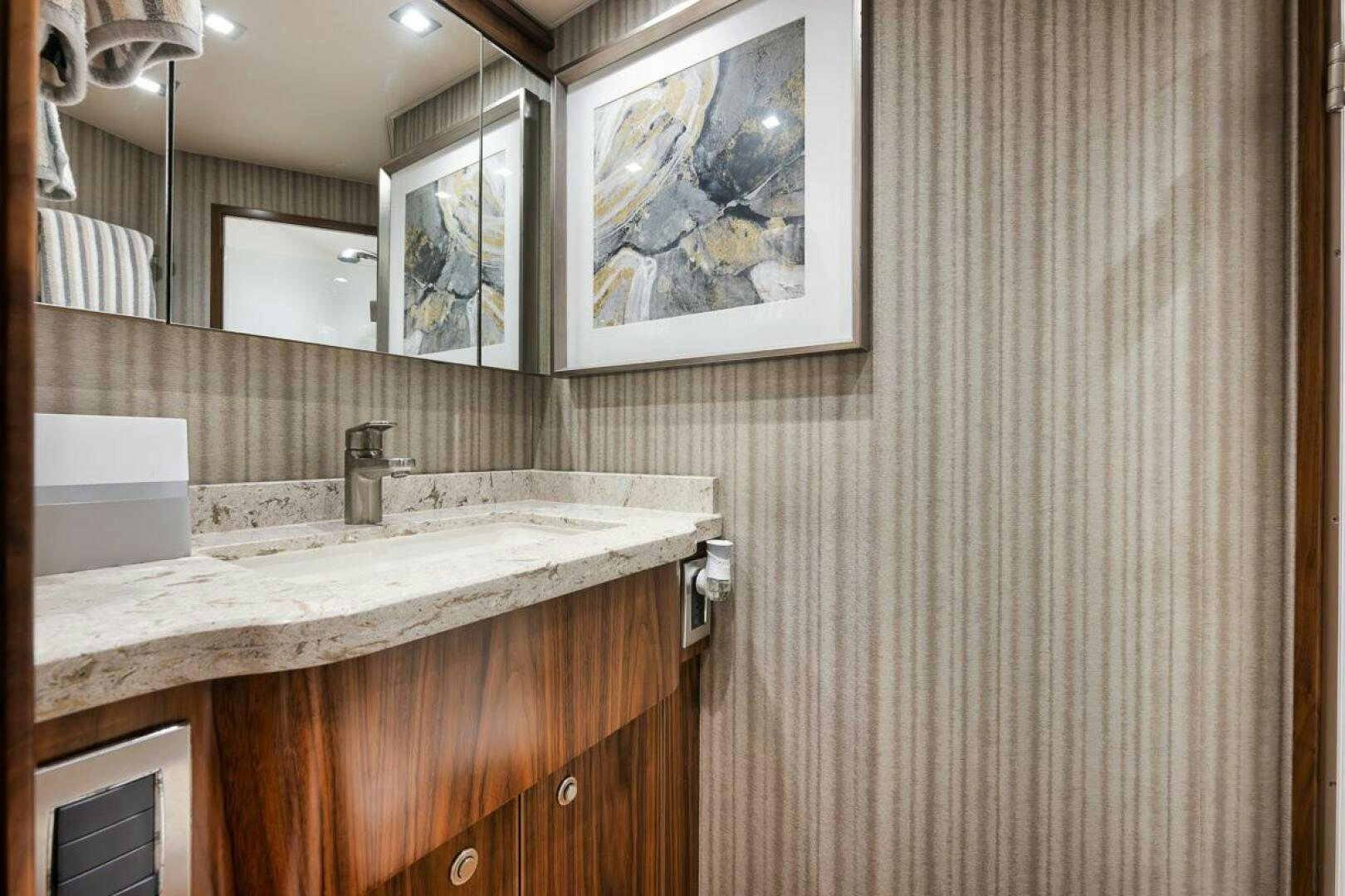 a bathroom with a sink and a mirror aboard JO-LI Yacht for Sale