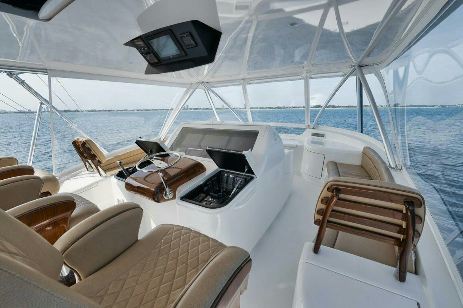 a boat with a table and chairs aboard JO-LI Yacht for Sale
