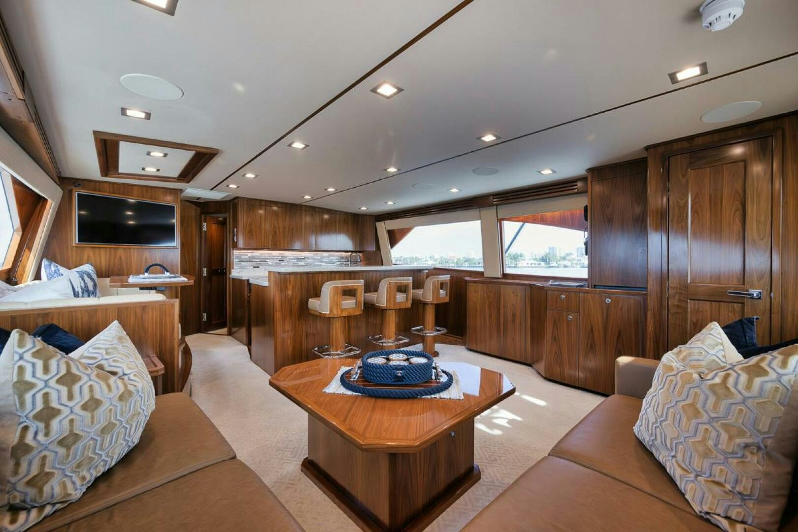 a living room with a wood floor aboard JO-LI Yacht for Sale