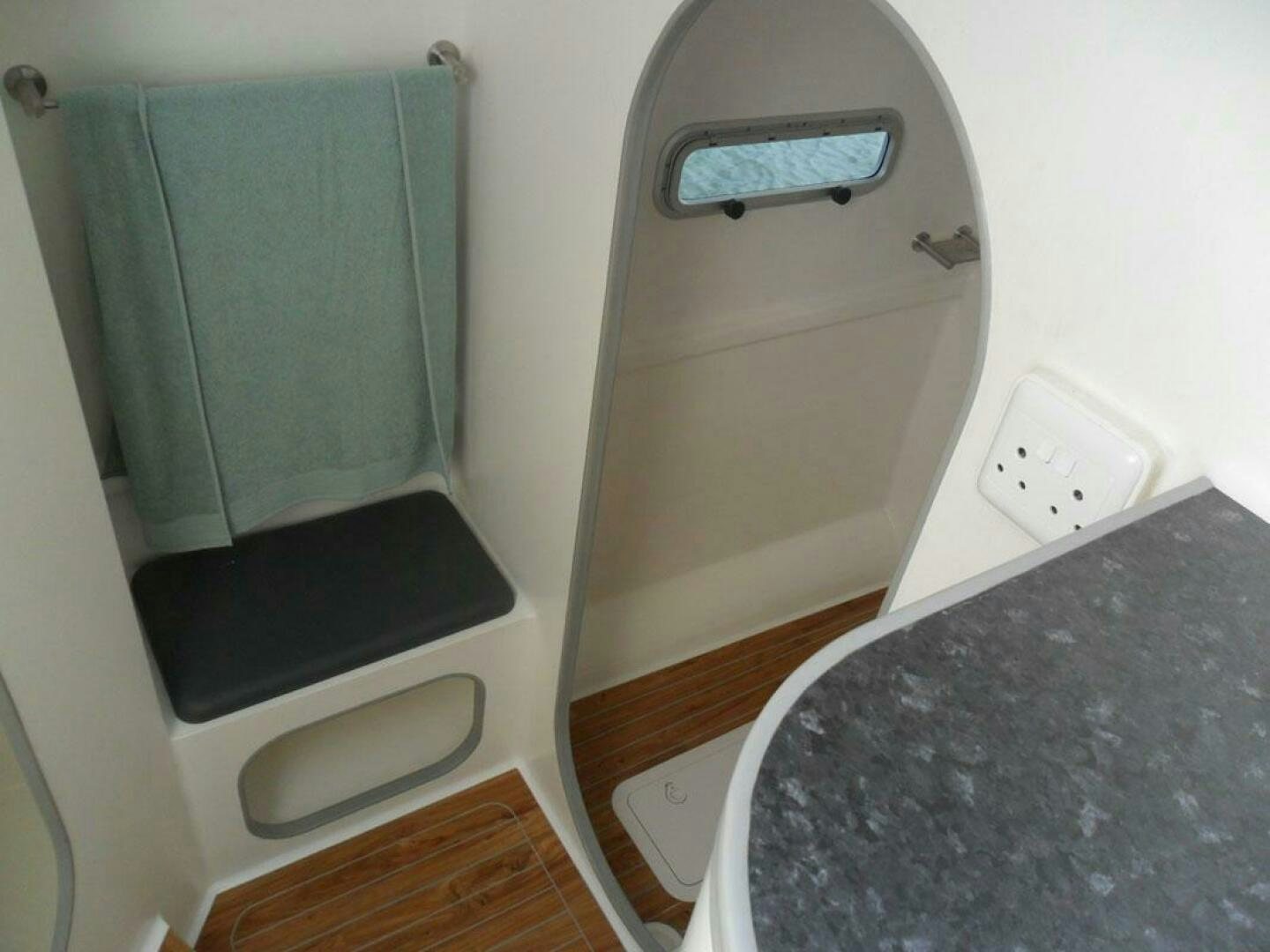 a small bathroom with a washer and dryer aboard SEA CHANT Yacht for Sale