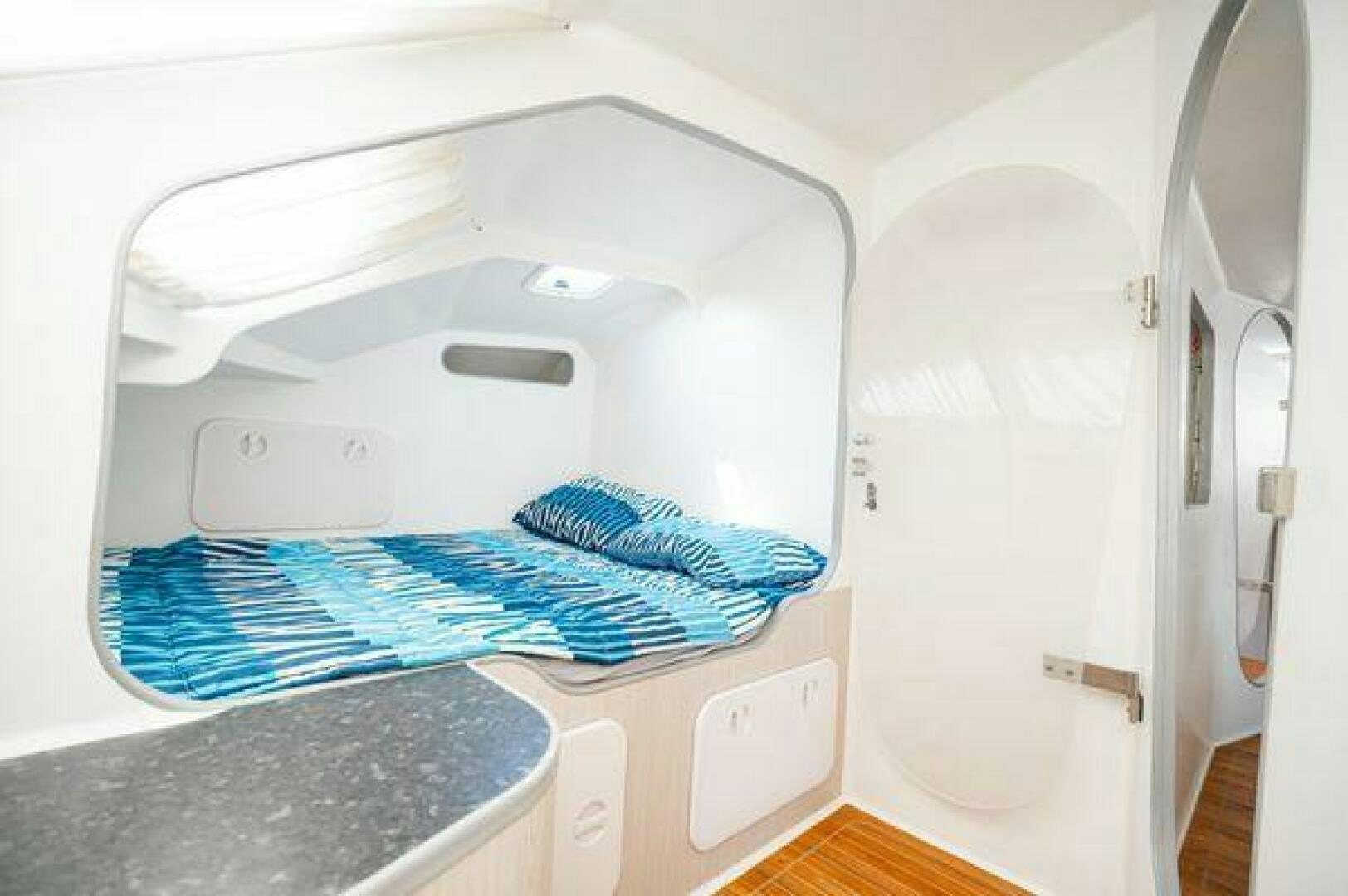 a white machine with a blue blanket aboard SEA CHANT Yacht for Sale