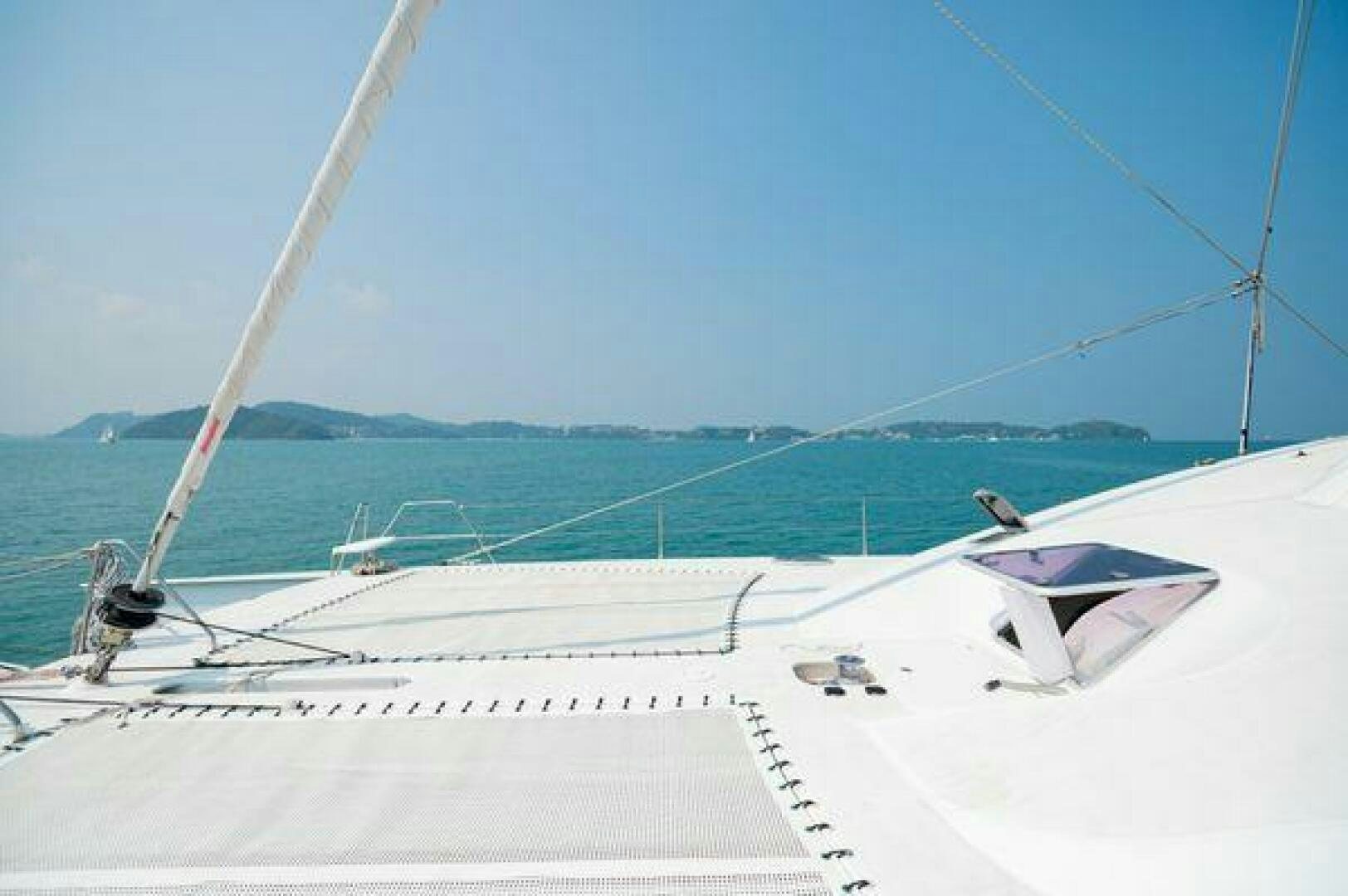 a white boat on the water aboard SEA CHANT Yacht for Sale