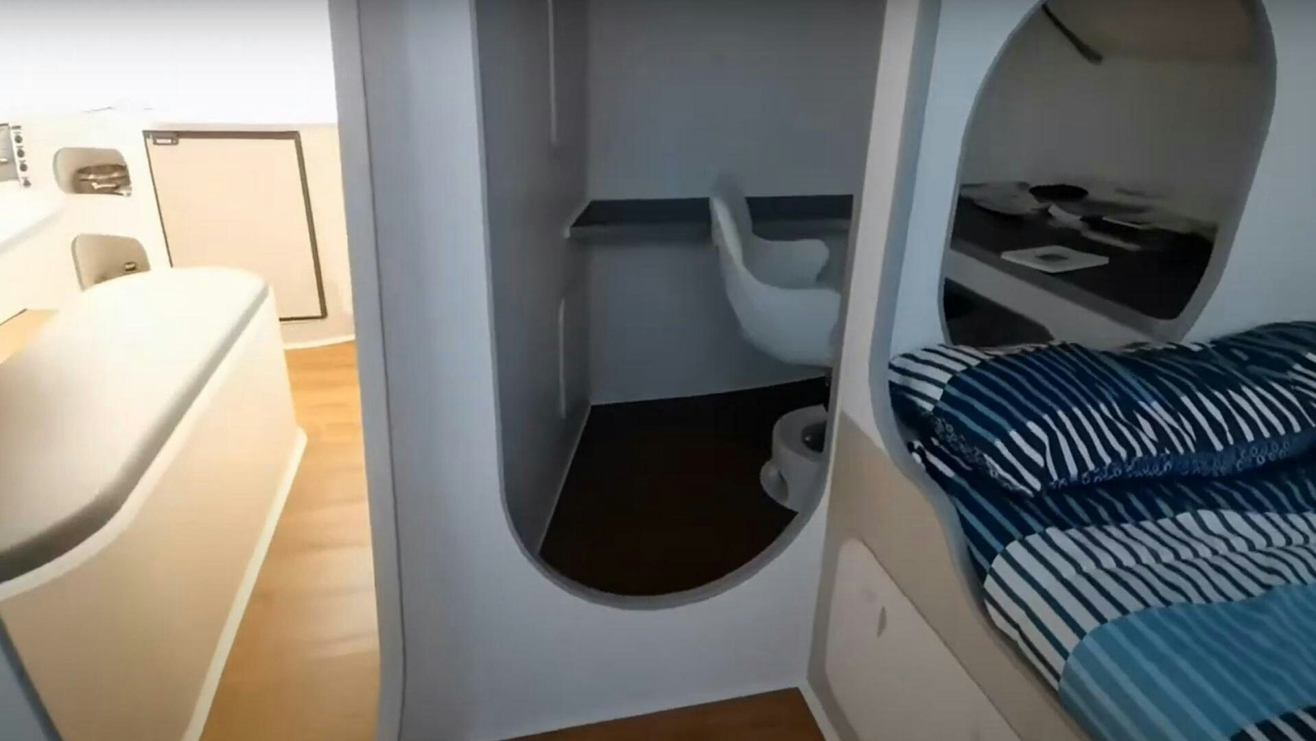a bathroom with a white toilet aboard SEA CHANT Yacht for Sale
