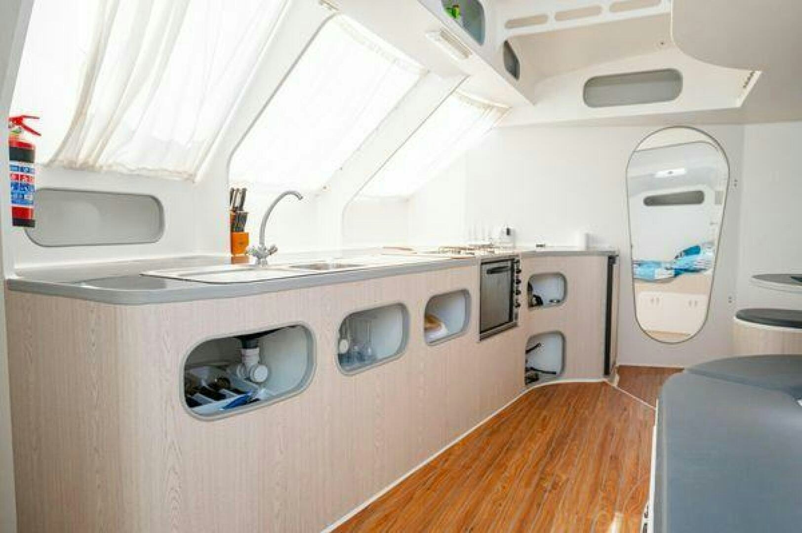 a small white vehicle with a large window aboard SEA CHANT Yacht for Sale