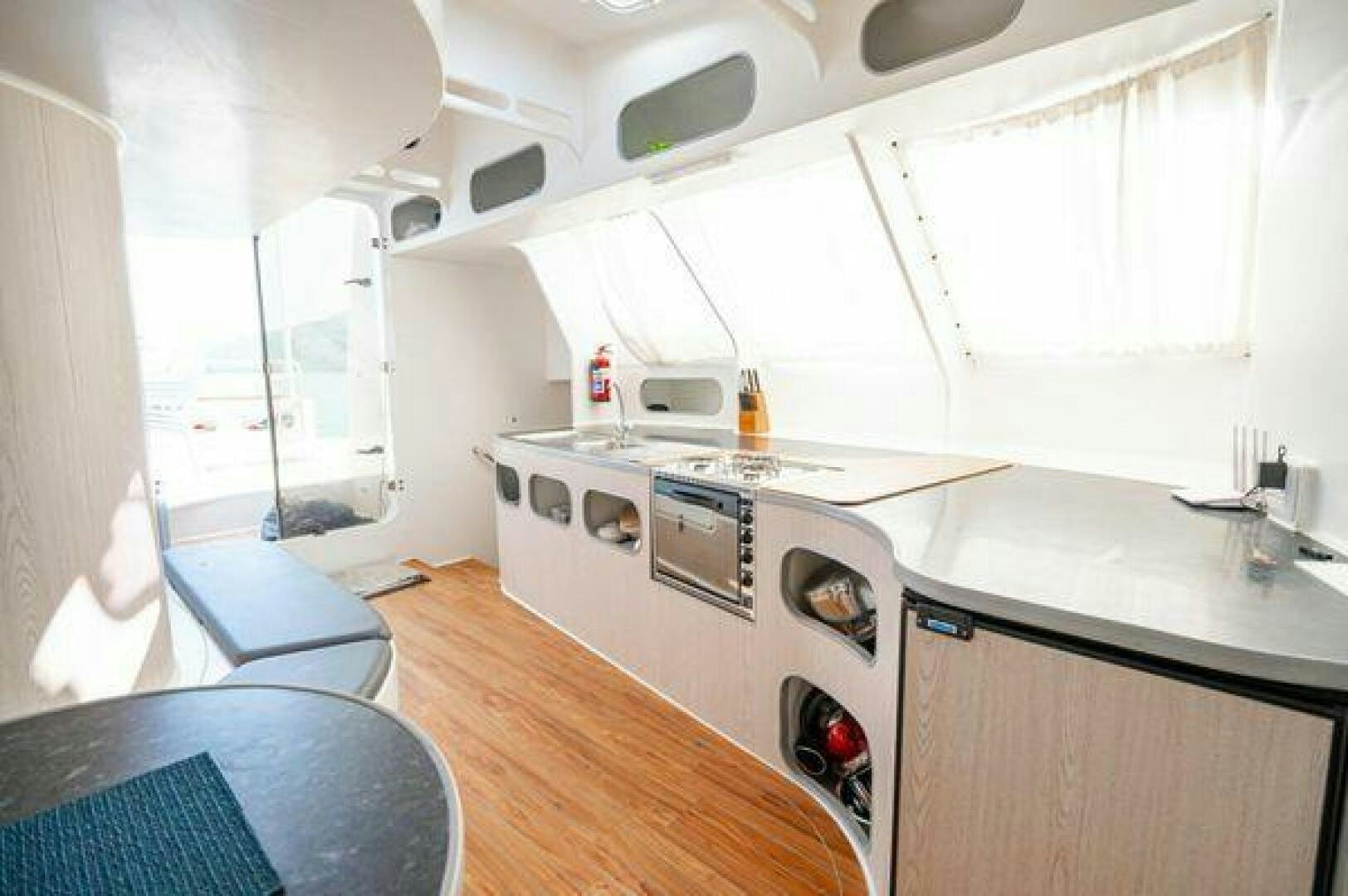 a small kitchen with a large window aboard SEA CHANT Yacht for Sale