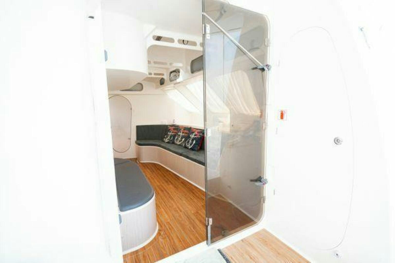 a white cabinet with a vent aboard SEA CHANT Yacht for Sale