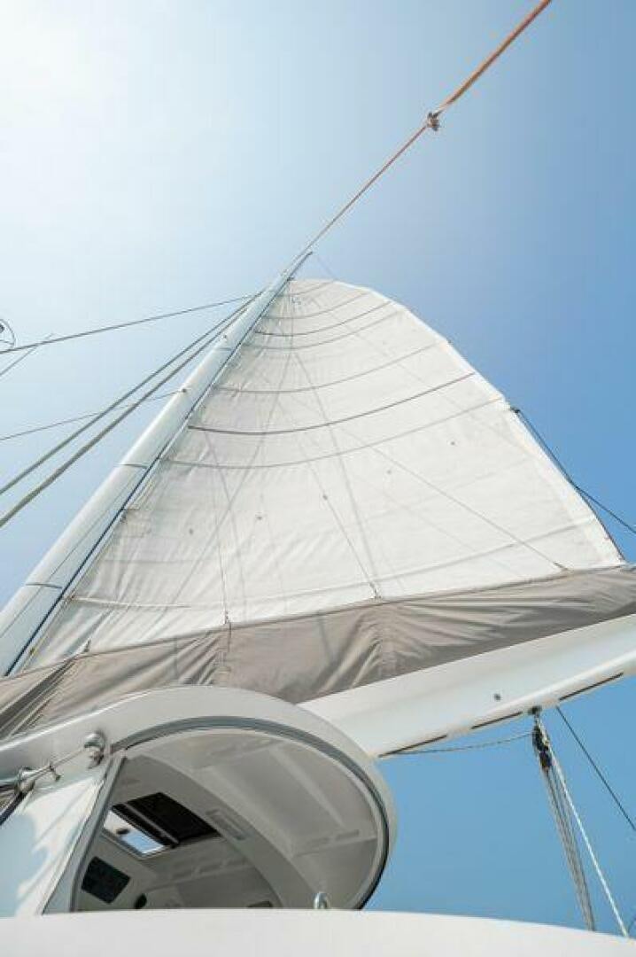 a sailboat with a white sail aboard SEA CHANT Yacht for Sale