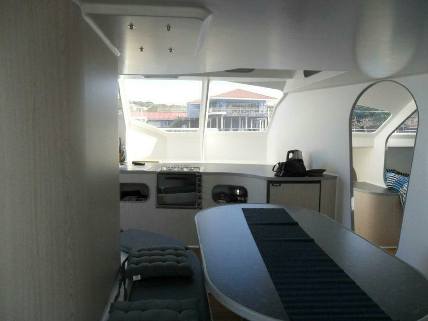a room with a bed and a window aboard SEA CHANT Yacht for Sale