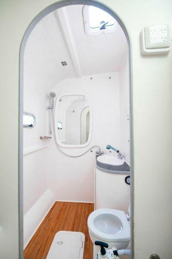 a small bathroom with a toilet aboard SEA CHANT Yacht for Sale