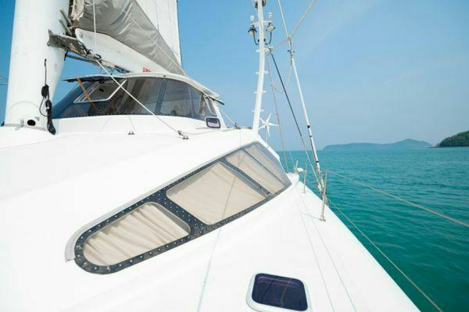 a white boat on the water aboard SEA CHANT Yacht for Sale