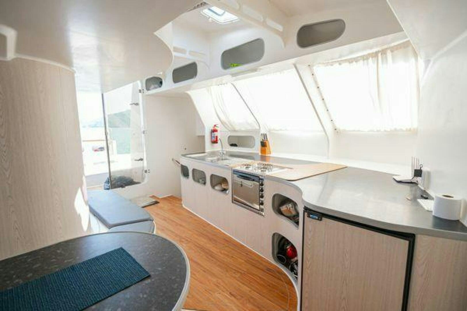 a kitchen with a stove and a sink aboard SEA CHANT Yacht for Sale