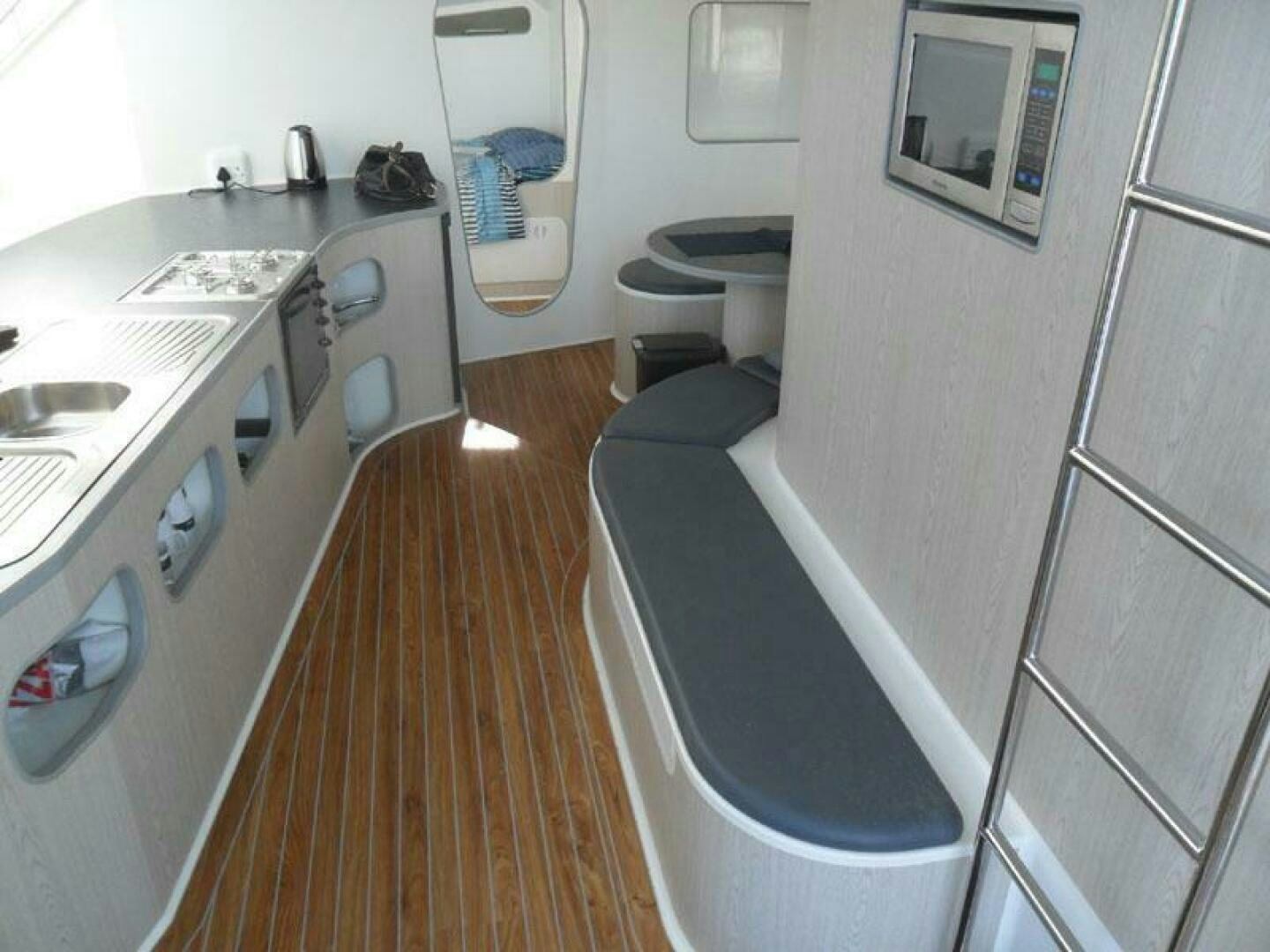 a small bathroom with a sink and a toilet aboard SEA CHANT Yacht for Sale