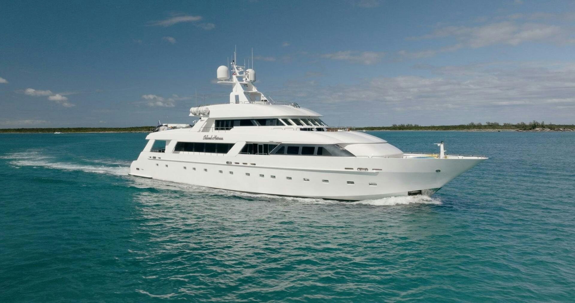 a white boat on the water aboard ISLAND HEIRESS Yacht for Sale