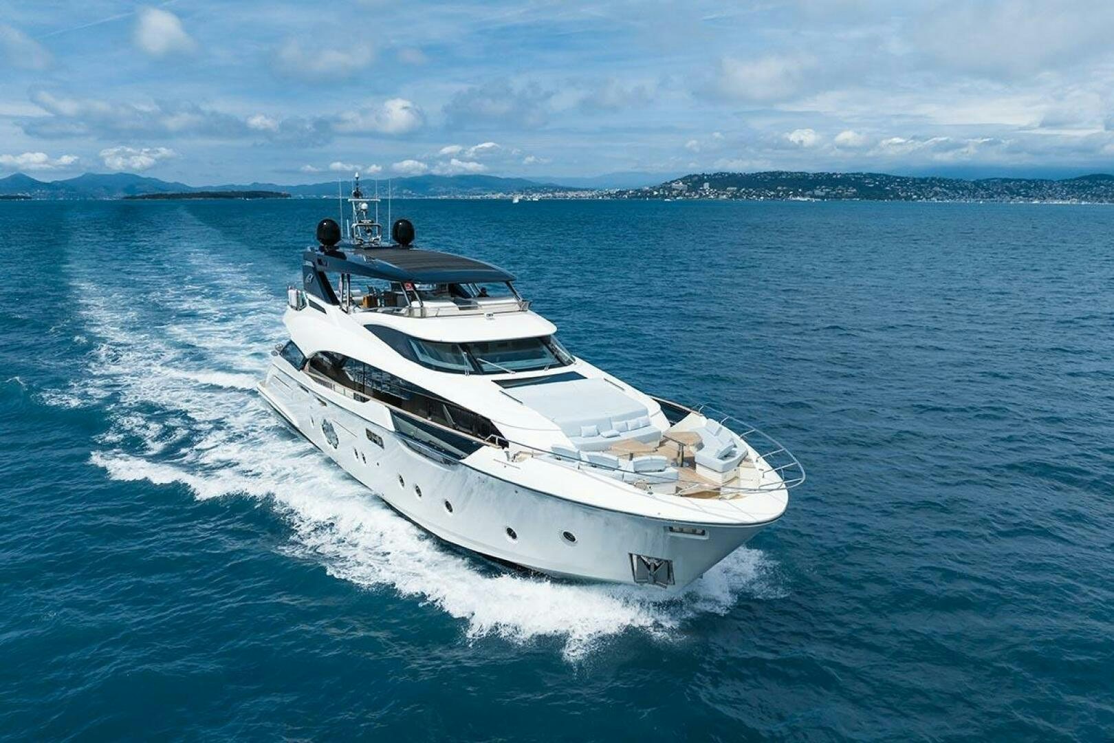 a white yacht in the water aboard ROCCO Yacht for Sale