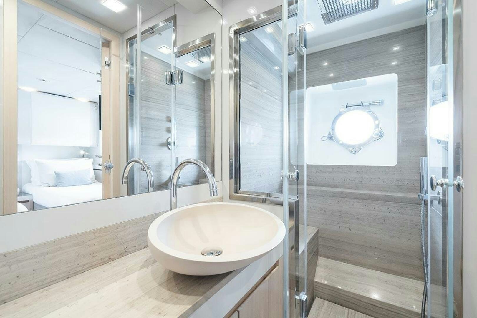 a bathroom with a sink and a mirror aboard ROCCO Yacht for Sale