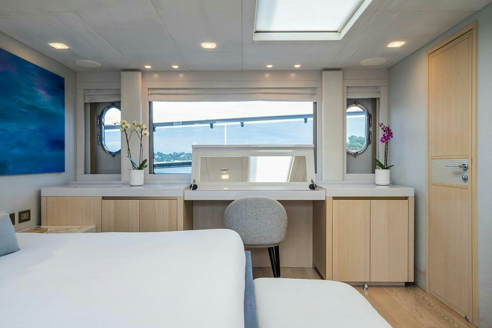 a room with a desk and a bed aboard ROCCO Yacht for Sale