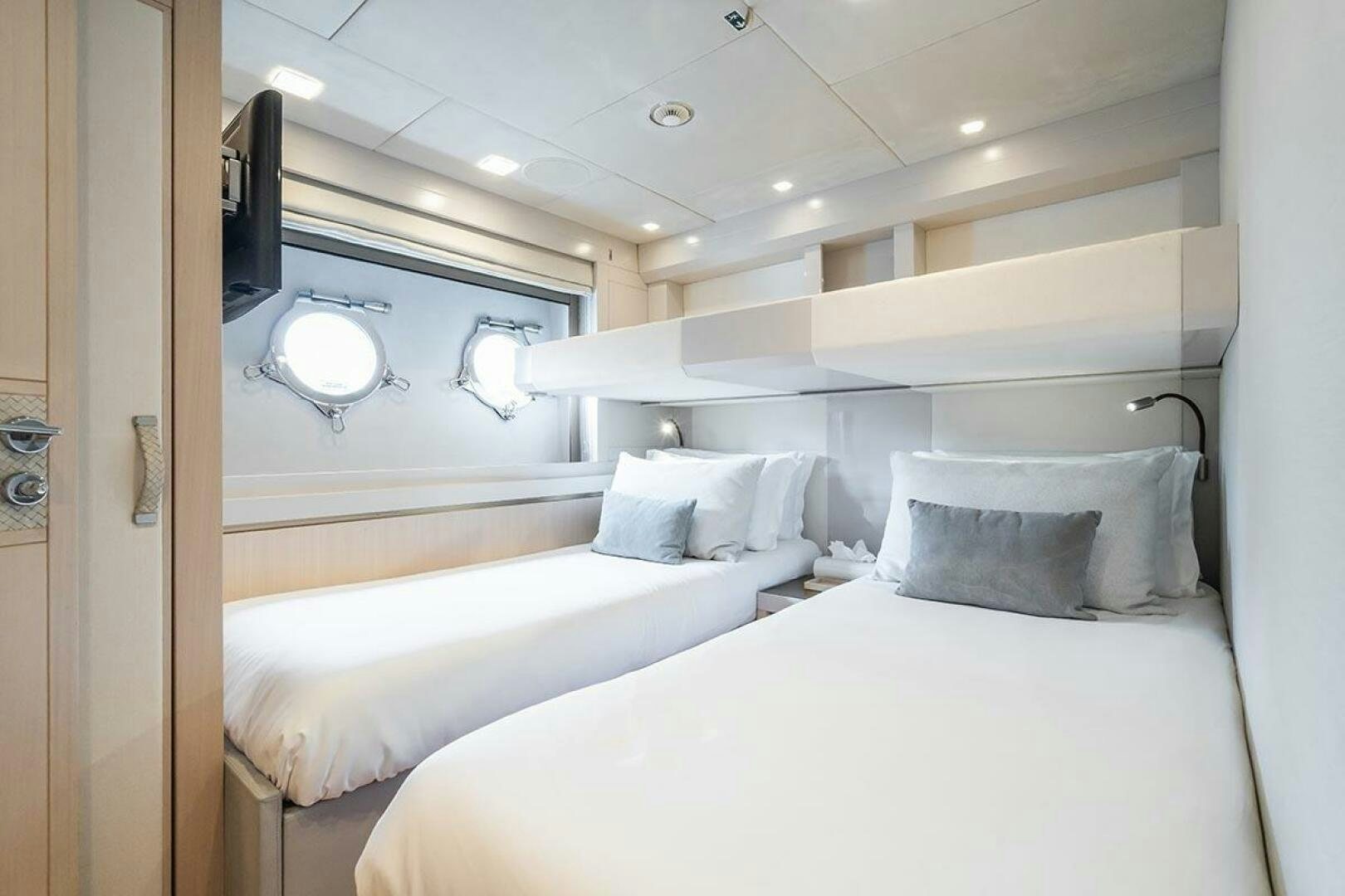 a room with two beds aboard ROCCO Yacht for Sale