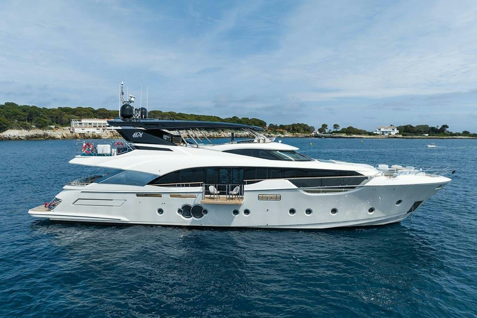 a white yacht in the water aboard ROCCO Yacht for Sale