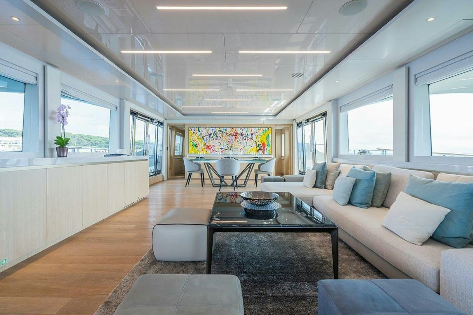 a living room with a large window aboard ROCCO Yacht for Sale