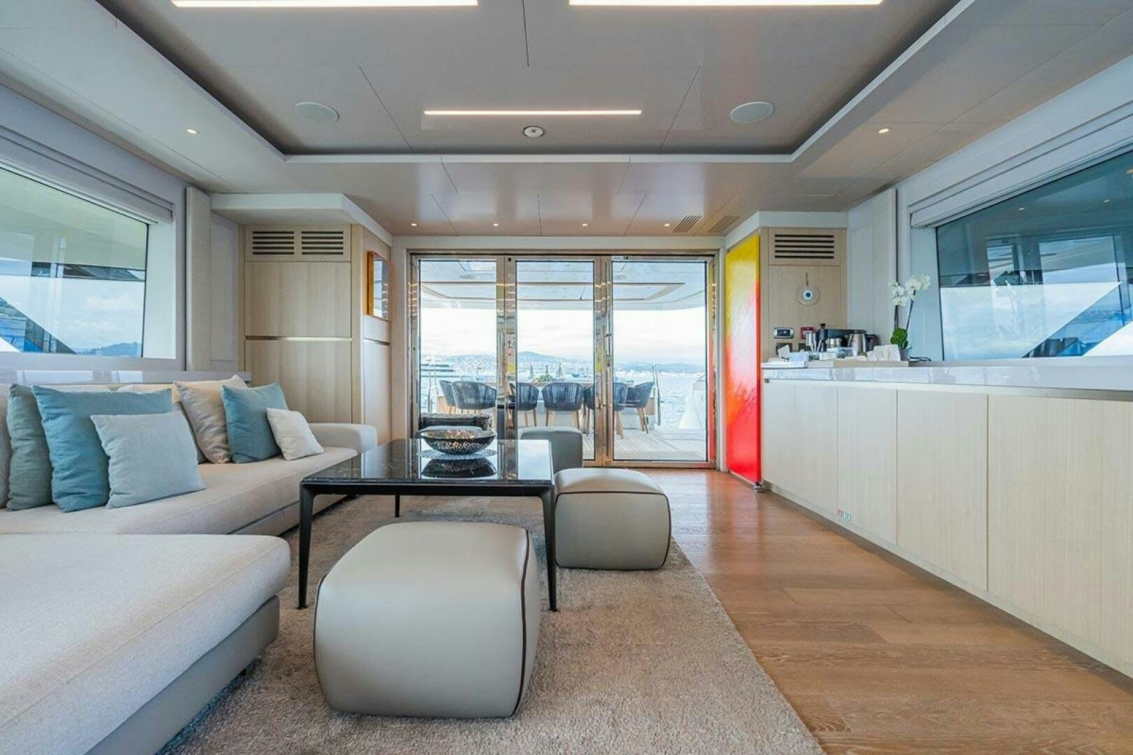 a living room with a large window aboard ROCCO Yacht for Sale